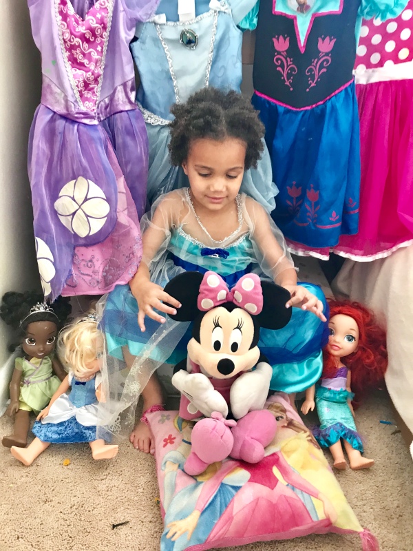 Mixed child holds Minnie Mouse