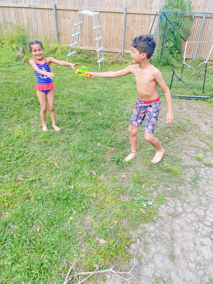 Water games are a great way to enjoy activities as a family. #familyactivities #budgetfriendlyactivites #freekidsactivities #springactivities #familyfun #wateractivities