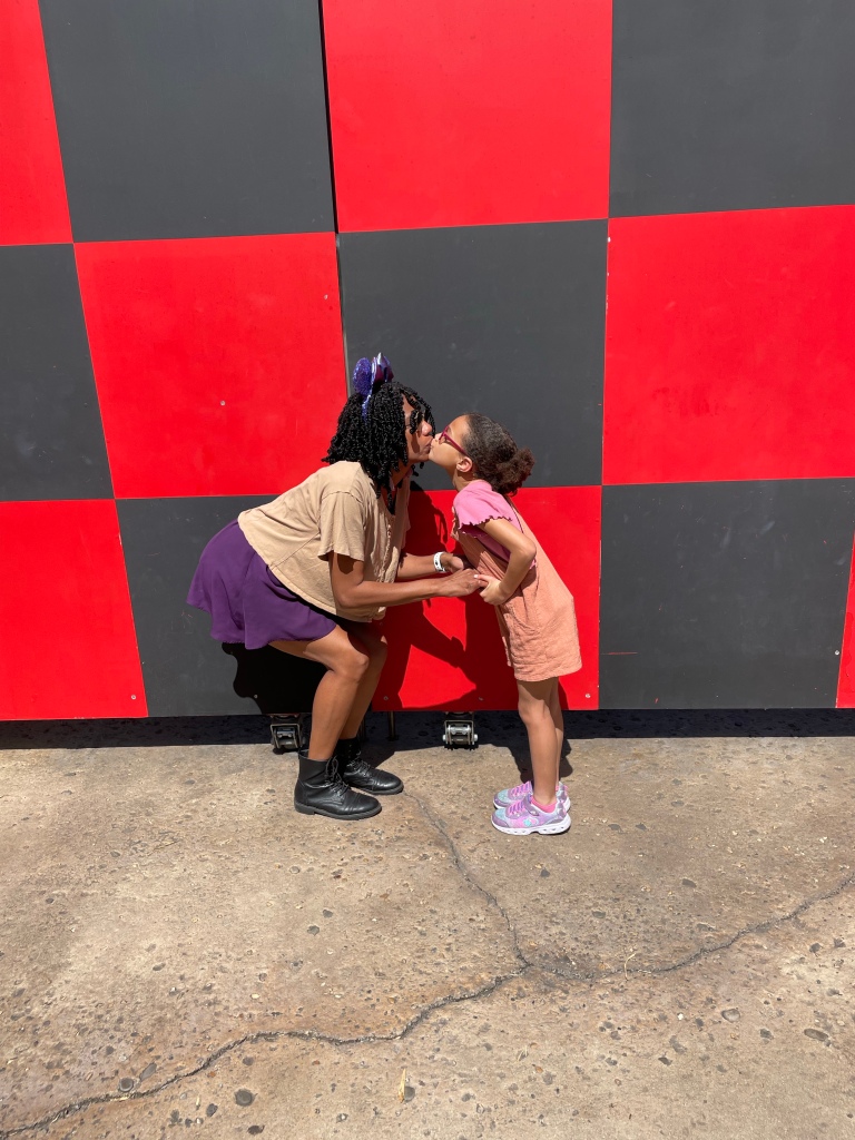Disney World Photo Spots - Checker Wall at the exit of Toy Story Mania | ordinarilyextraordinarymom #hollywoodstudios #disneyworldphotos #disneyphotos #disneyphotospots #disneyphotoideas #disneyphotoideaskids