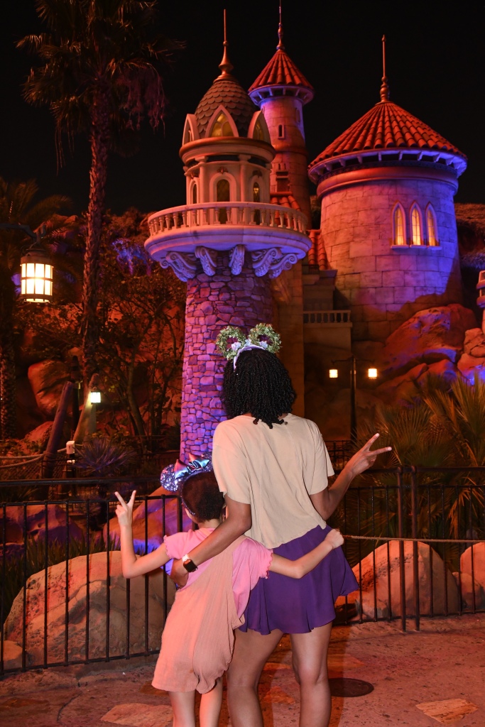 Disney Photo Ideas - Rapunzel's castle at night via Disney Photo Pass | ordinarilyextraordinarymom #disneyworldphotos #disneyphotos #disneyphotospots #disneyphotoideas #disneyphotoideaskids #magickingdom